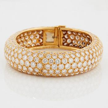 Cartier armring 18K guld med runda briljantslipade diamanter.