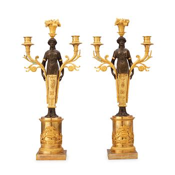497. A pair of Empire early 19th century three-light candelabra.