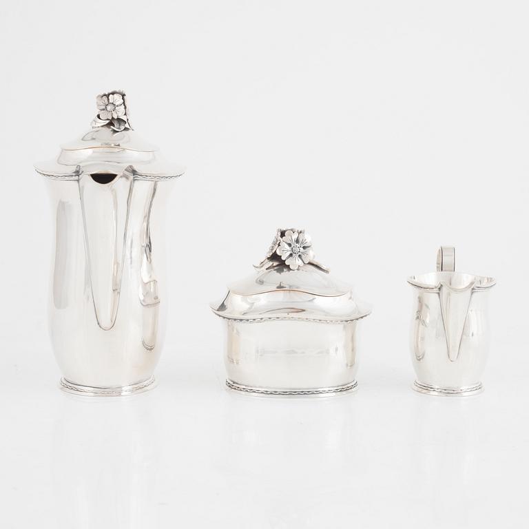 A Swedish Silver Coffee Pot, Creamer and Sugar Bowl, mark of Carl Fredrik Carlman, Stockholm 1951-54.