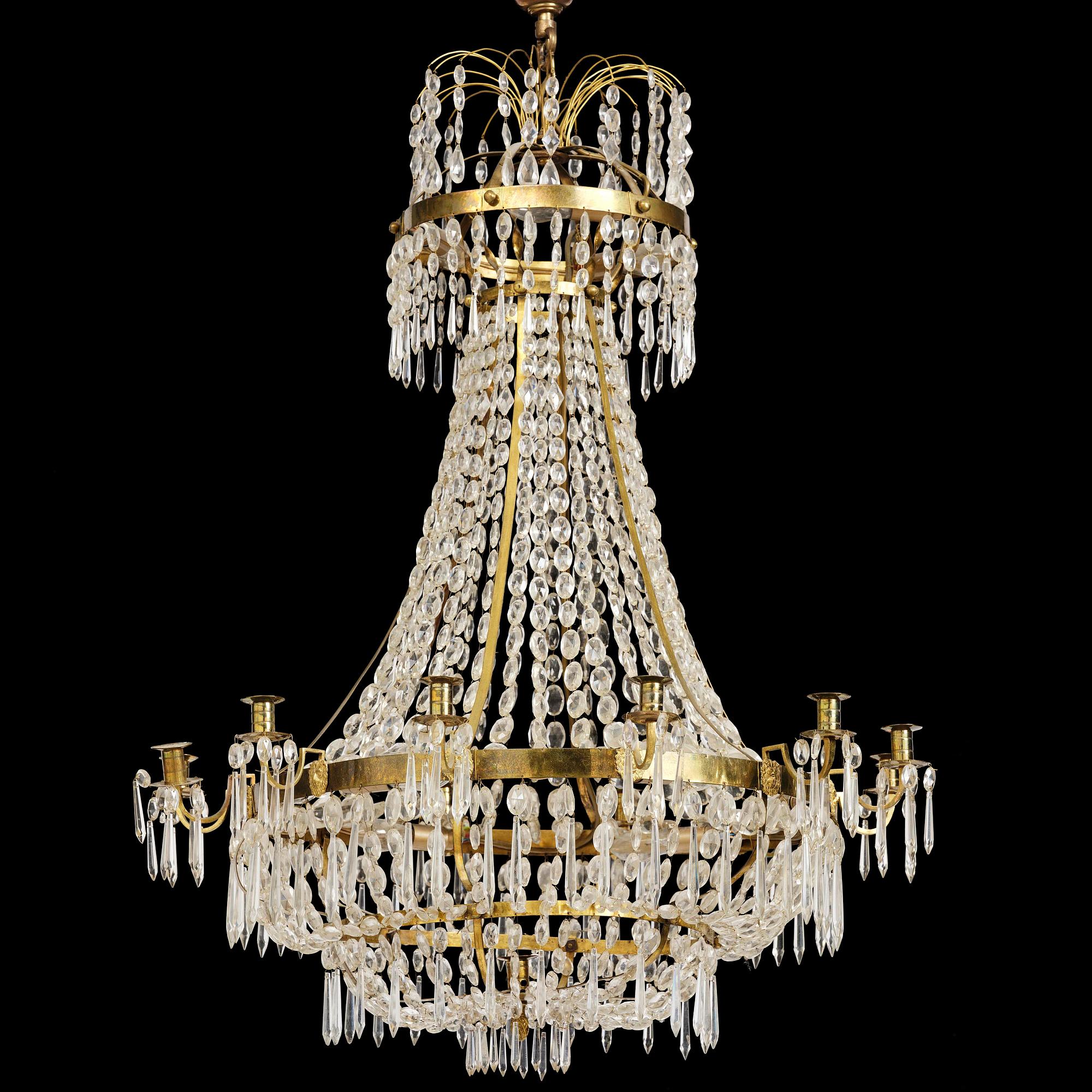 A Swedish gilt brass and cut glass thirteen-light Empire chandelier, early 19th century.