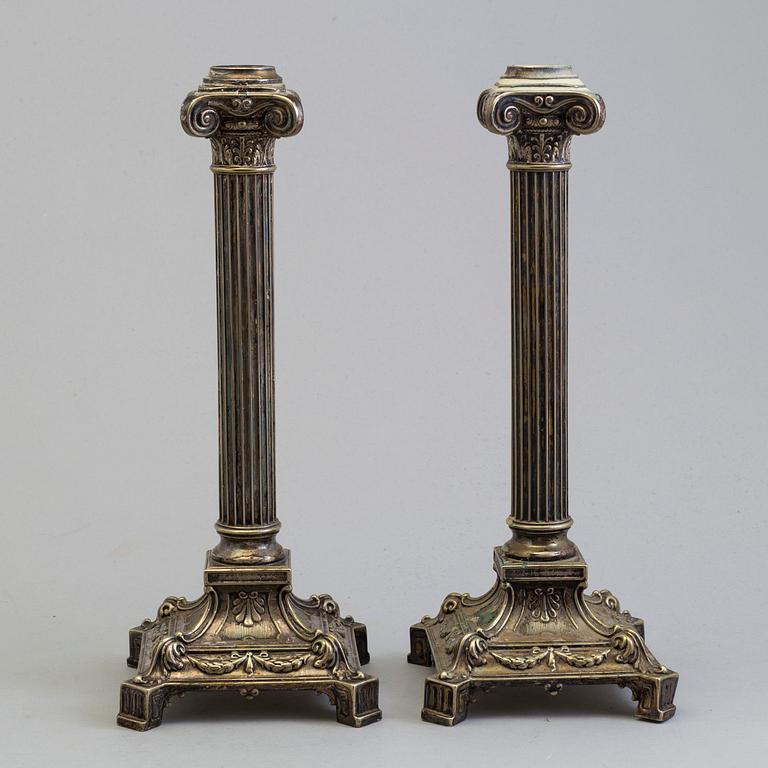 A pair of plated candel sticks from the fist half of the 20th century.