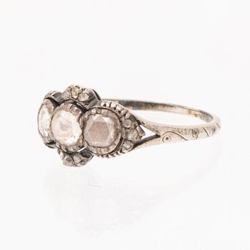 An 18K white gold ring set with rose cut diamonds.