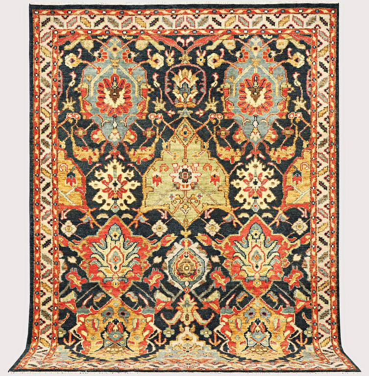 An oriental carpet with Mamluk design, a. 331 x 274 cm.
