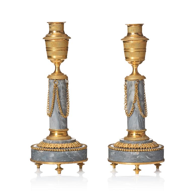 A pair of Louis XVI ormolu and marble cassolettes, late 18th century.