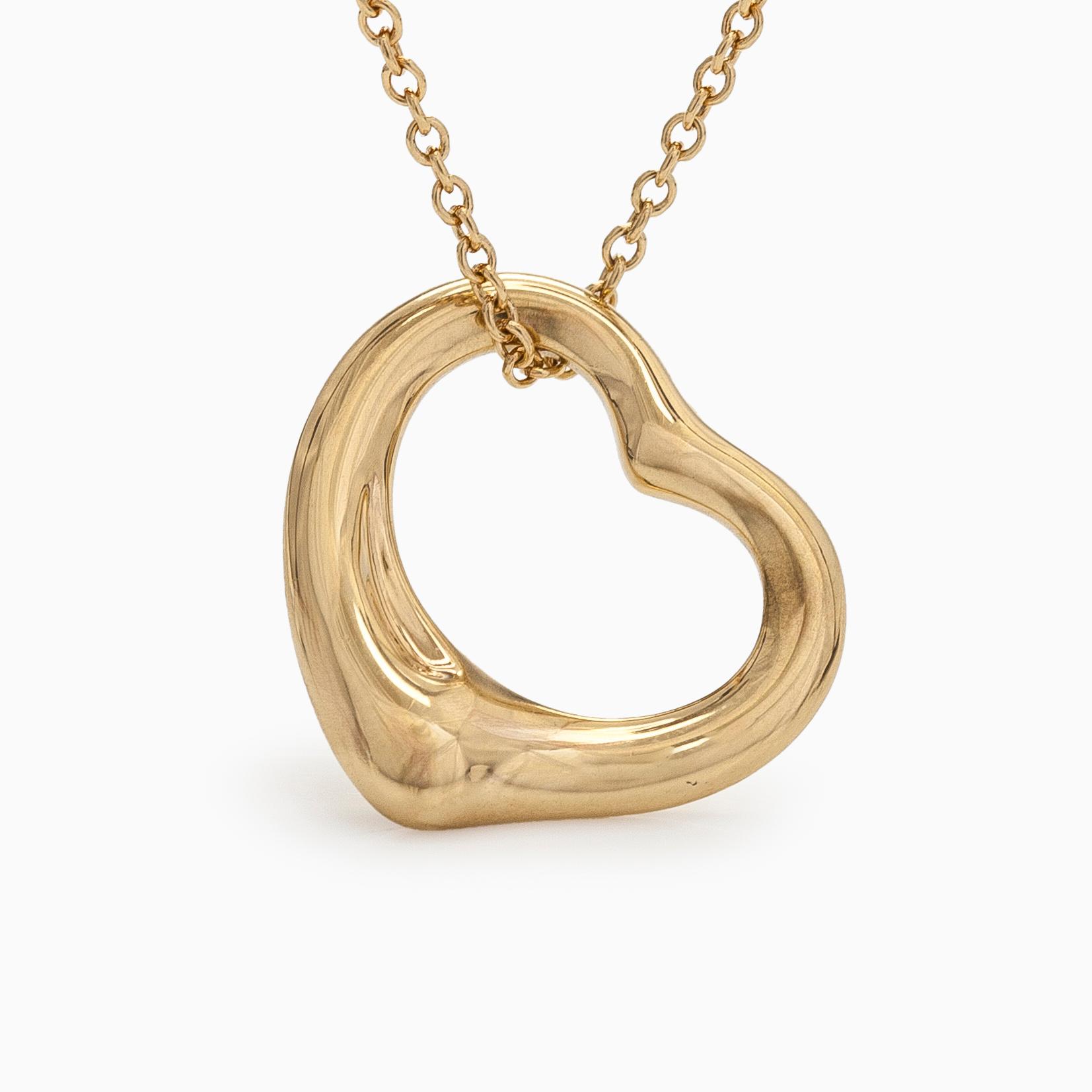 Tiffany & Co, Elsa Peretti, an 18K gold "Open Heart" necklace.
