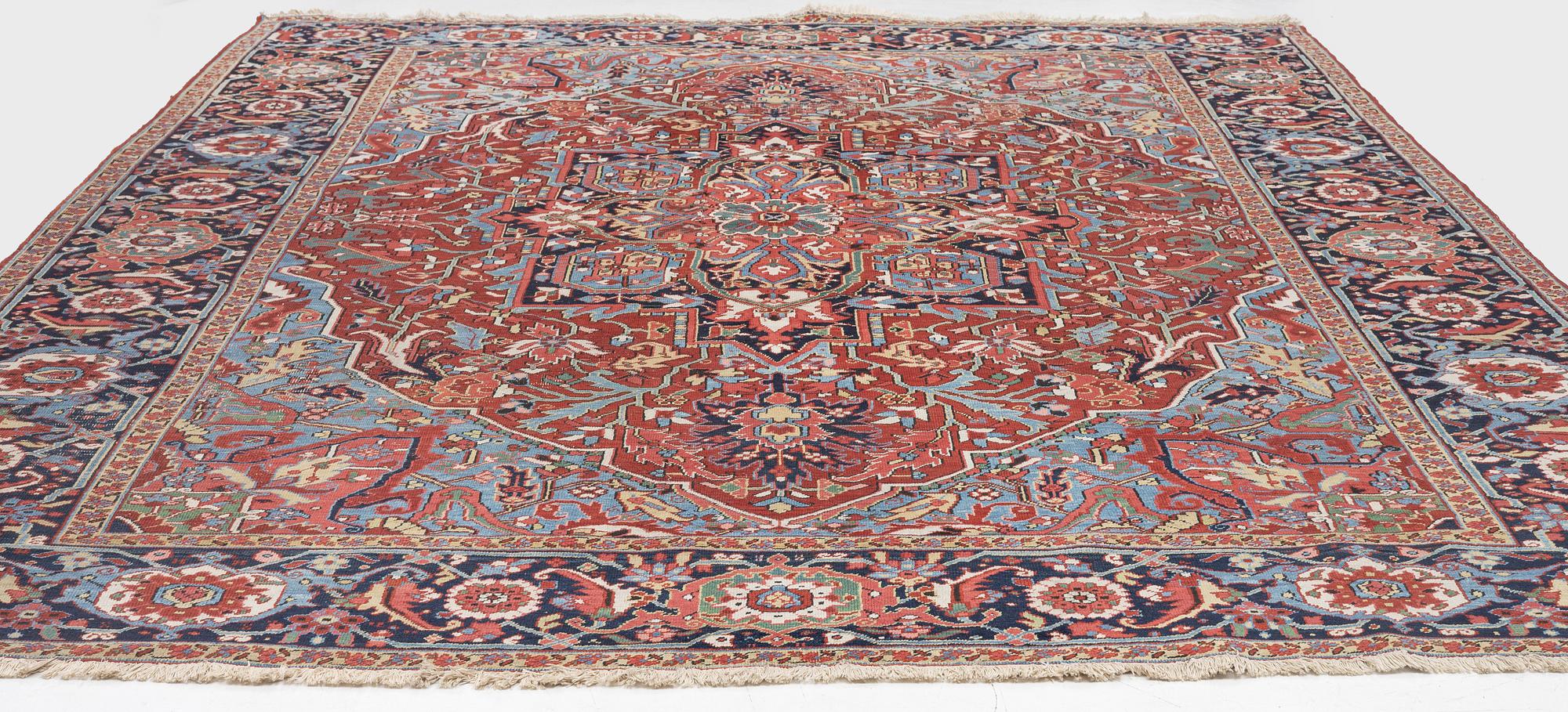 An Antique Heriz carpet, North west persia, c. 380 x 310 cm.
