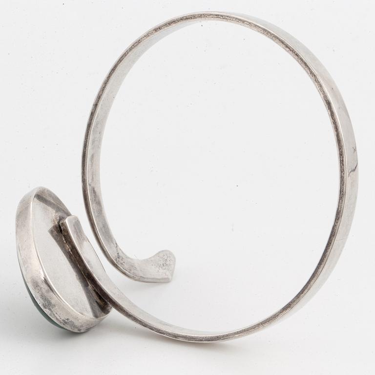 Isaac Cohen silver bangle with green stone.