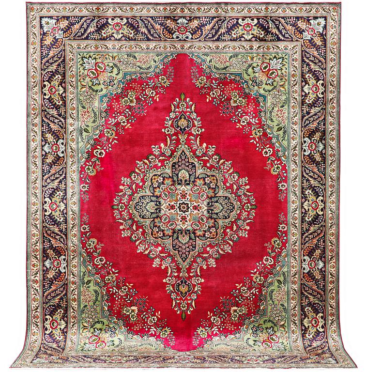 A Tabriz carpet, c. 330 x 250 cm.