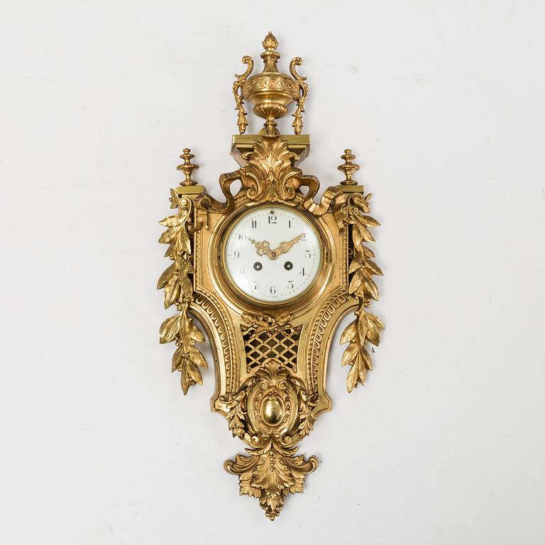 A first half of the 20th century brass wall clock.