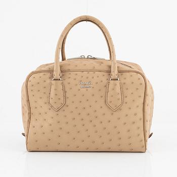 Prada, a beige ostrich leather bag.