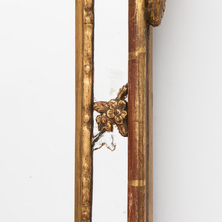 A Rococo style mirror, circa 1900.