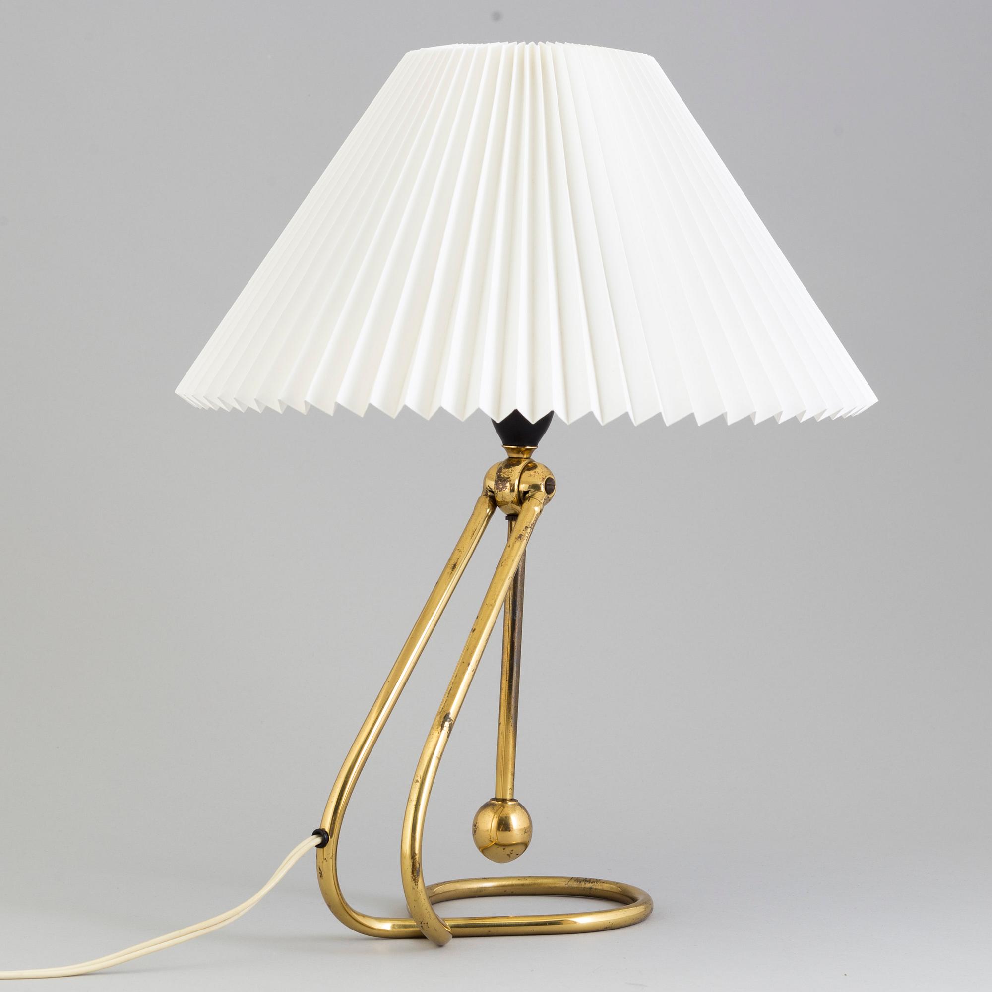 A Le Klint brass table or wall lamp.