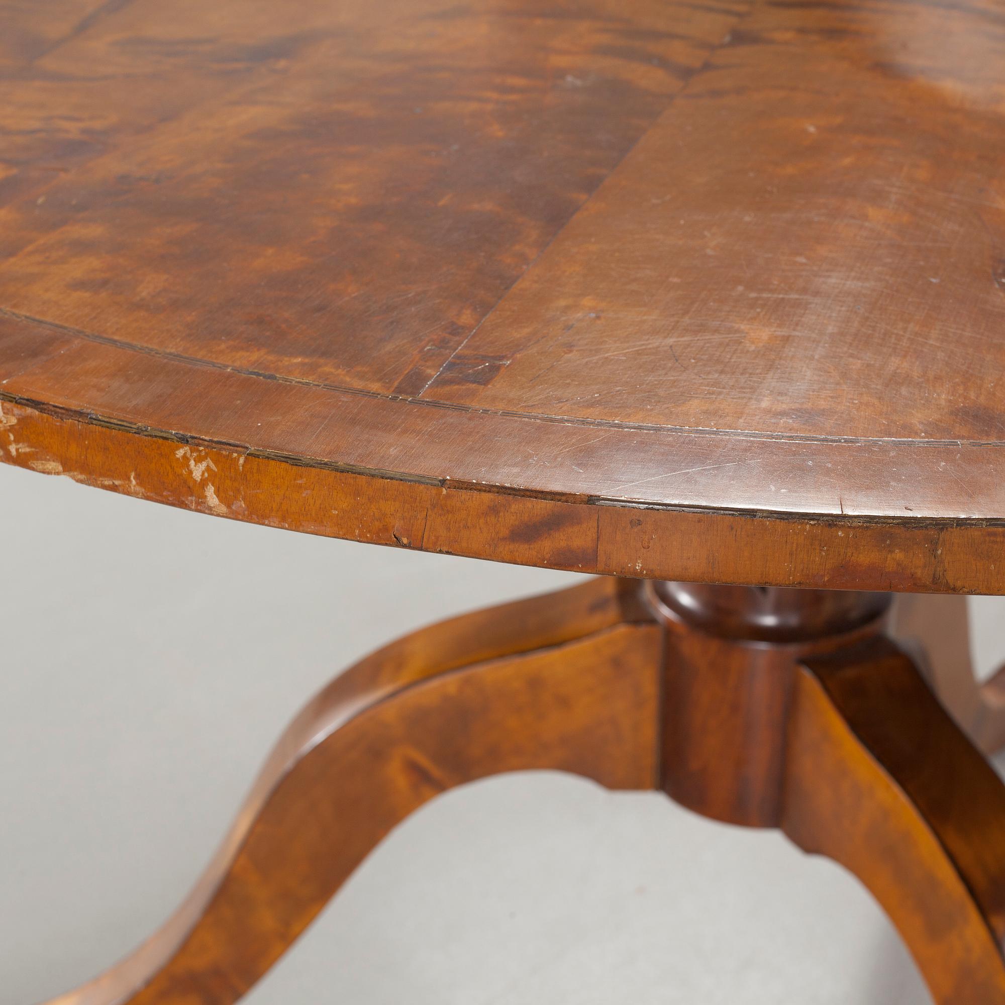 A 19th century drop-leaf table.