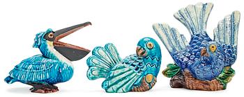 366. Three Gunnar Nylund stoneware figures, a pelican and two parrots, Rörstrand.