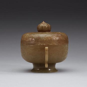 A carved archaistic nephrite bowl with cover decorated with taotie-masks, China, 20th Century.