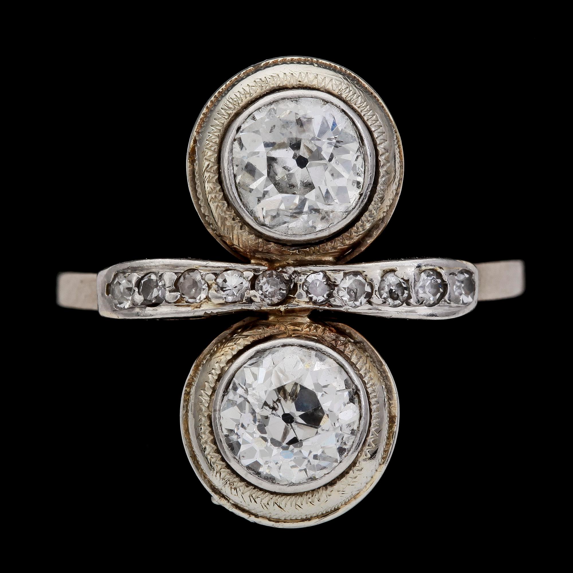 An old cut diamond ring, app. 1 cts each stone.