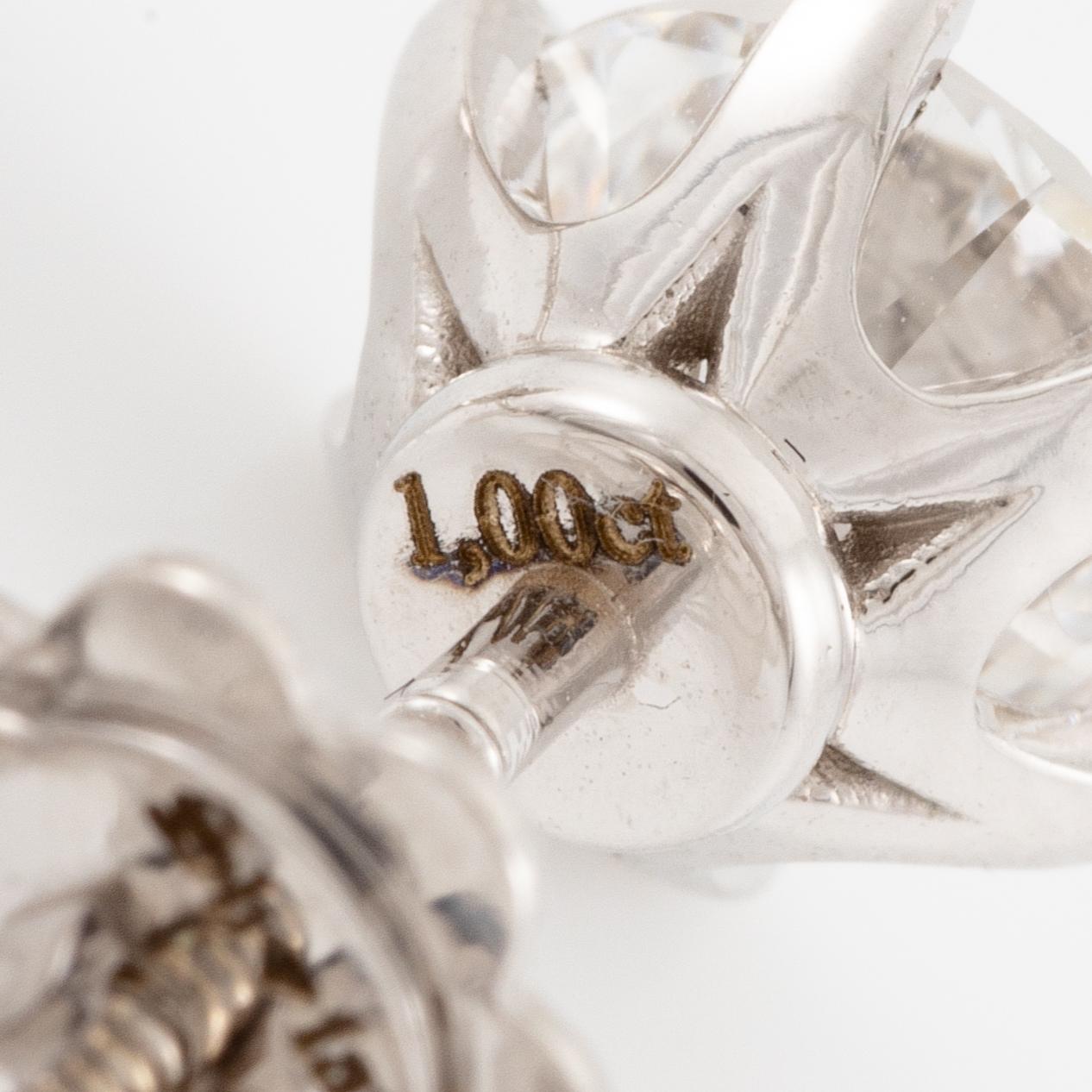 Brilliant-cut diamond stud earrings.