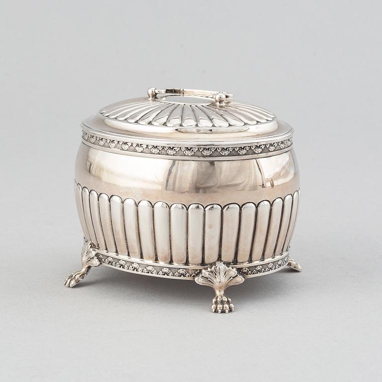 A silver creamer by Johan Petter Ahlforss, Strängnäs, 1833 and a silver sugar box, Kristianstad, 1928.