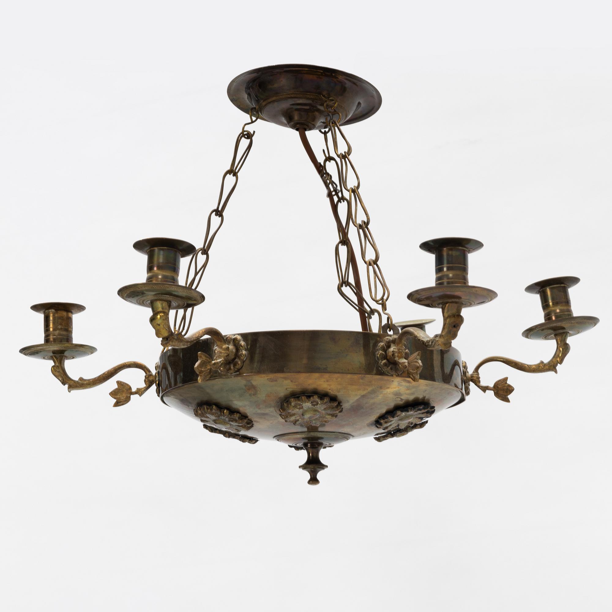 An empire style brass chandelier, around 1900.