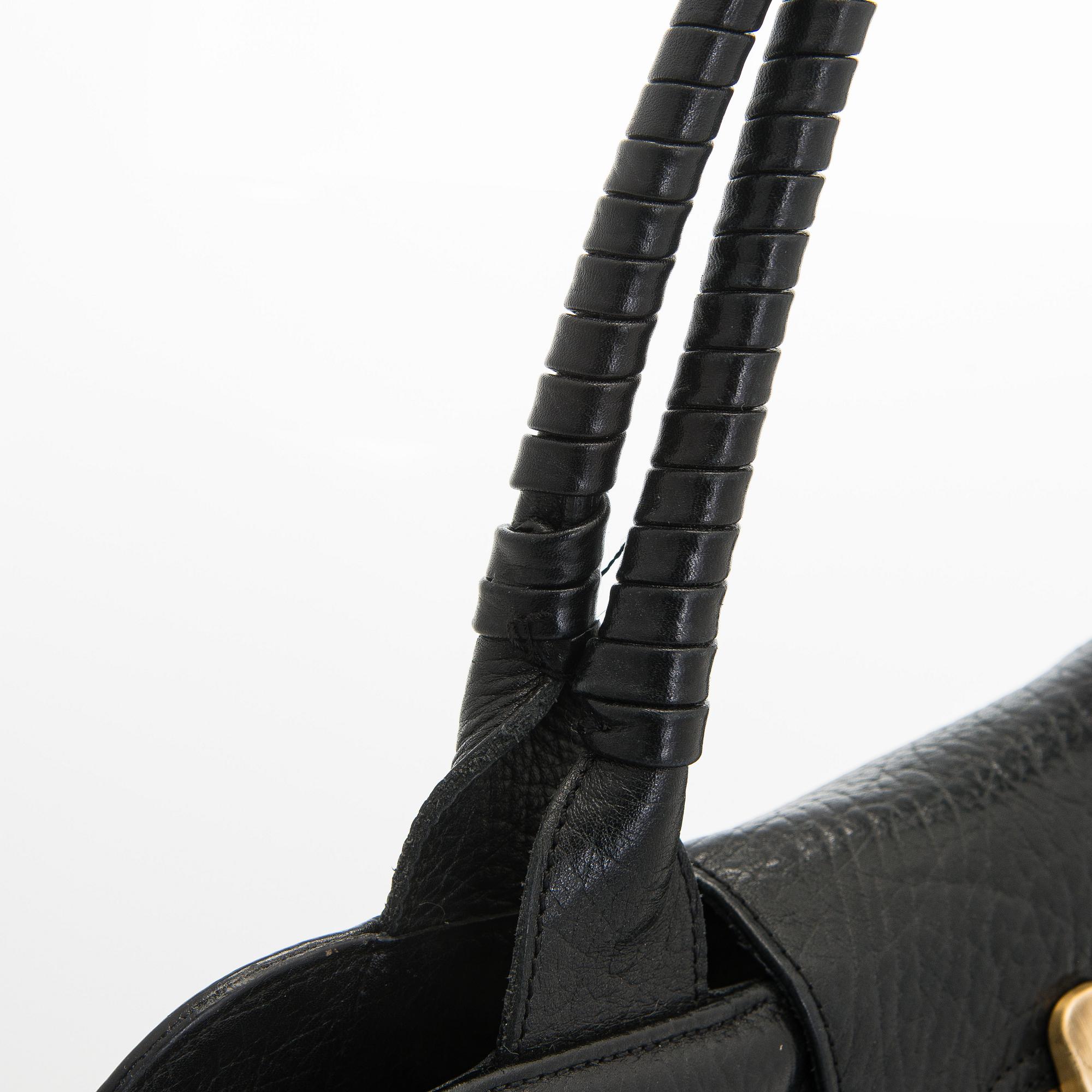 Max Mara, a leather handbag.