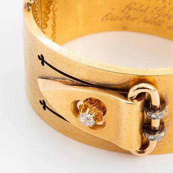 An 18K gold bangle set with old- and rose-cut diamonds.