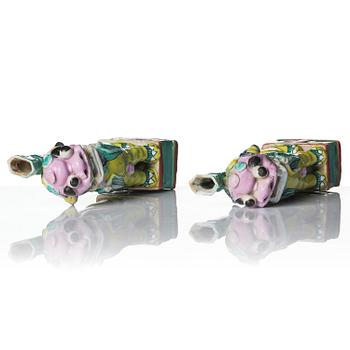 A pair of famille rose 'buddhist lion' joss stick holders, Qing dynasty, circa 1800.