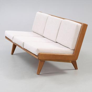 A Carl Gustaf Hiort af Ornäs walnut sofa, Finland 1950's.