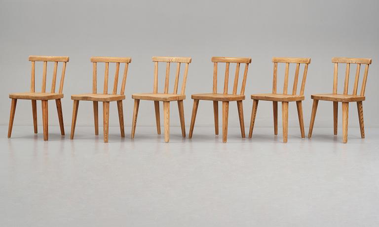 Axel Einar Hjorth, a set of six "Utö" stained pine chairs, Nordiska Kompaniet, Sweden 1930's.