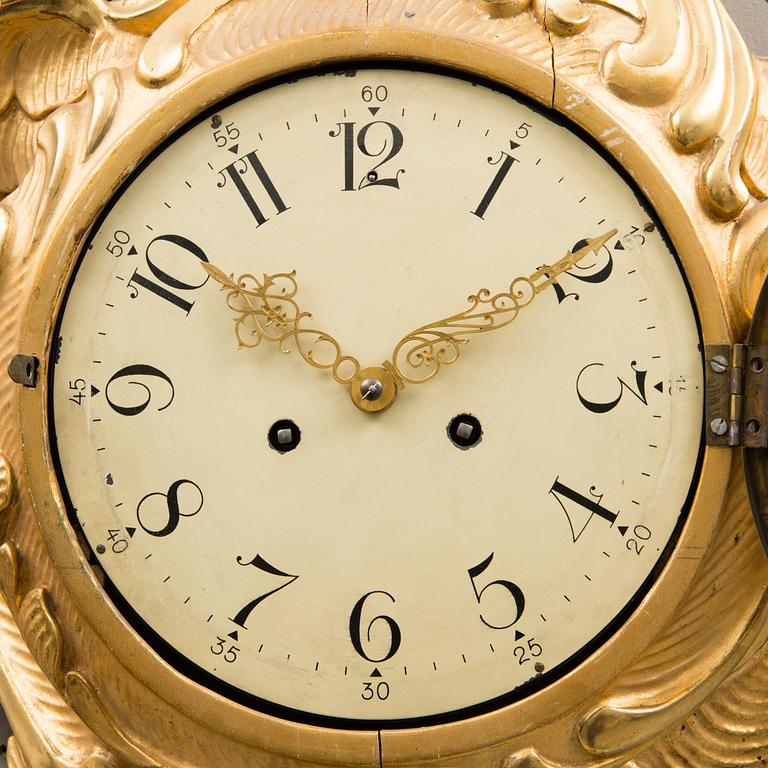 A Rococo-style pendulum wall clock from the 20th century. - Bukowskis