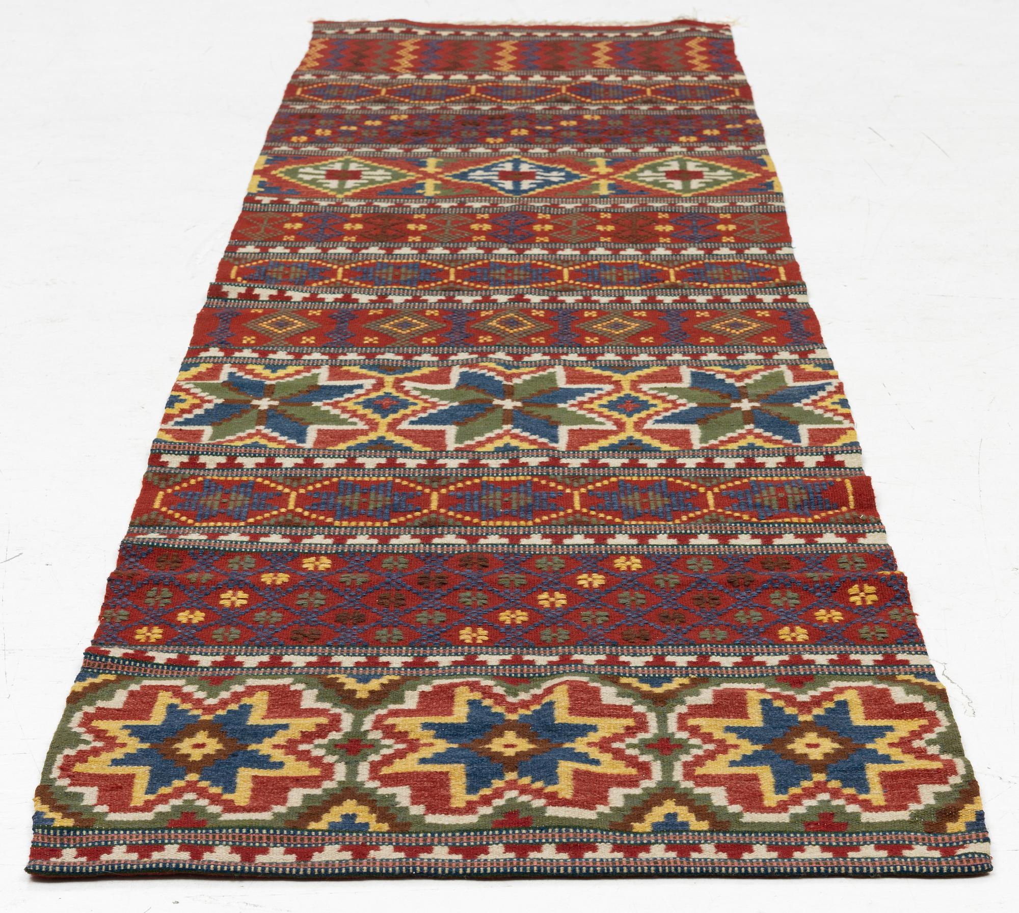 A bench cushion, flat weave, c. 262 x 64 cm, Scania, around the year 1900.