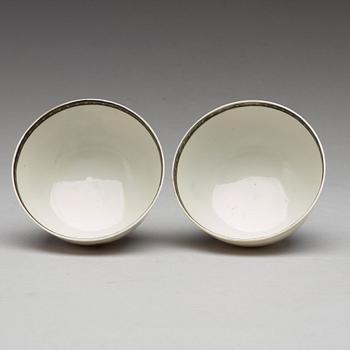 A pair of armorial grisaille cups, Qing dynasty, Qianlong (1736-95).