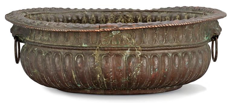 A Baroque copper wine cooler.