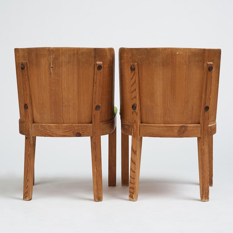 Axel Einar Hjorth, a pair of stained pine 'Lovö' chairs, Nordiska Kompaniet Sweden 1930s.