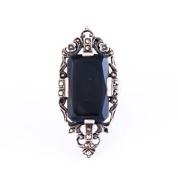 Four Art deco jewelry, ring, pendant necklace and earrings in silver.