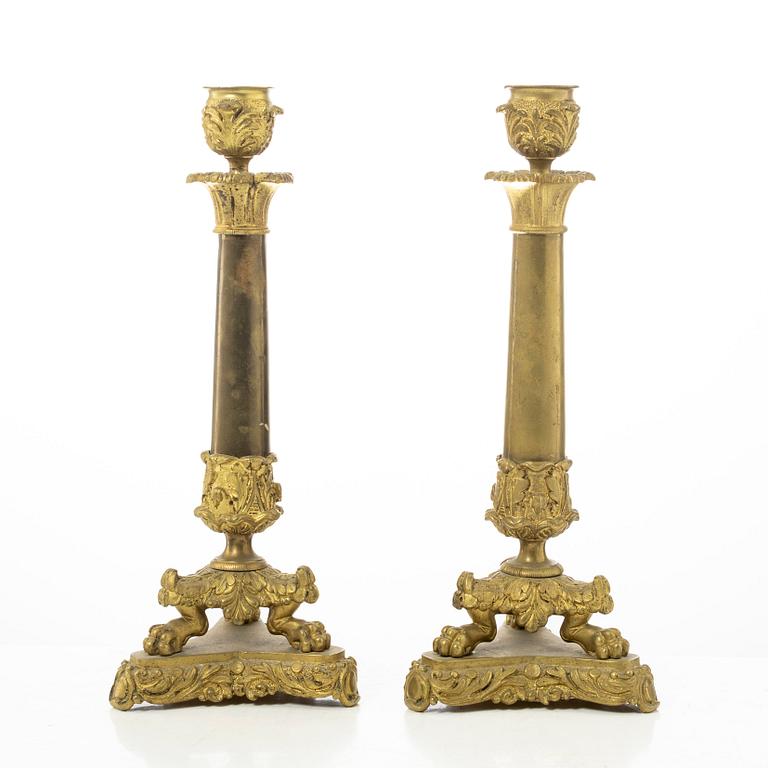 A pair of brass and bronze late Empire candle sticks, mid 20th century.