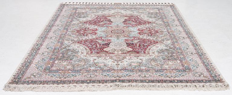 A Tabriz carpet, 210 x 195 cm. signed.