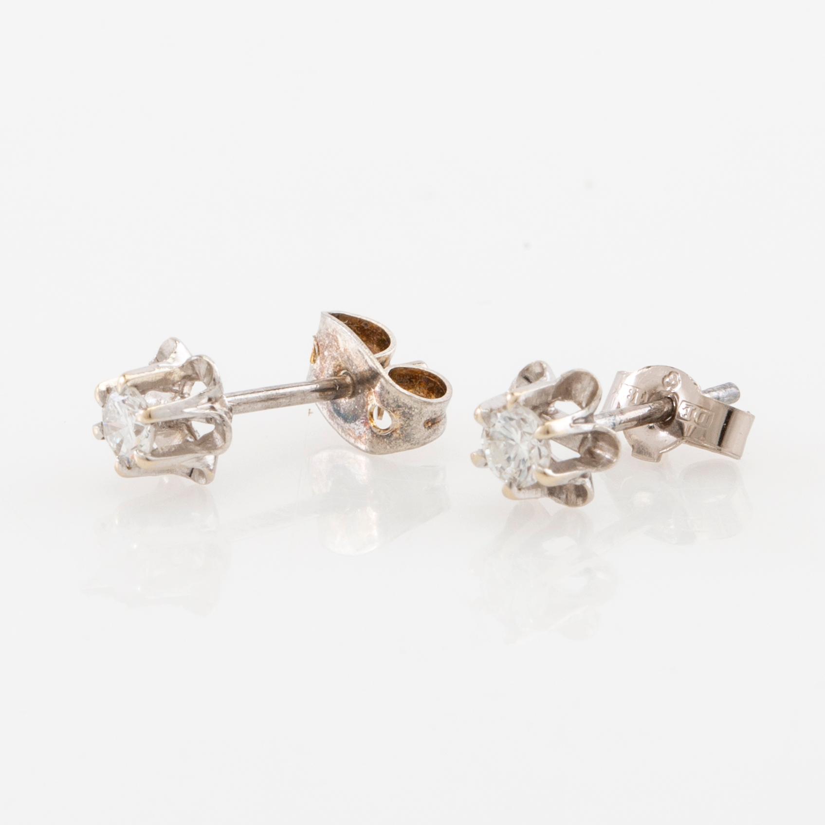 Earrings, a pair of 18K white gold set with round brilliant-cut diamonds.