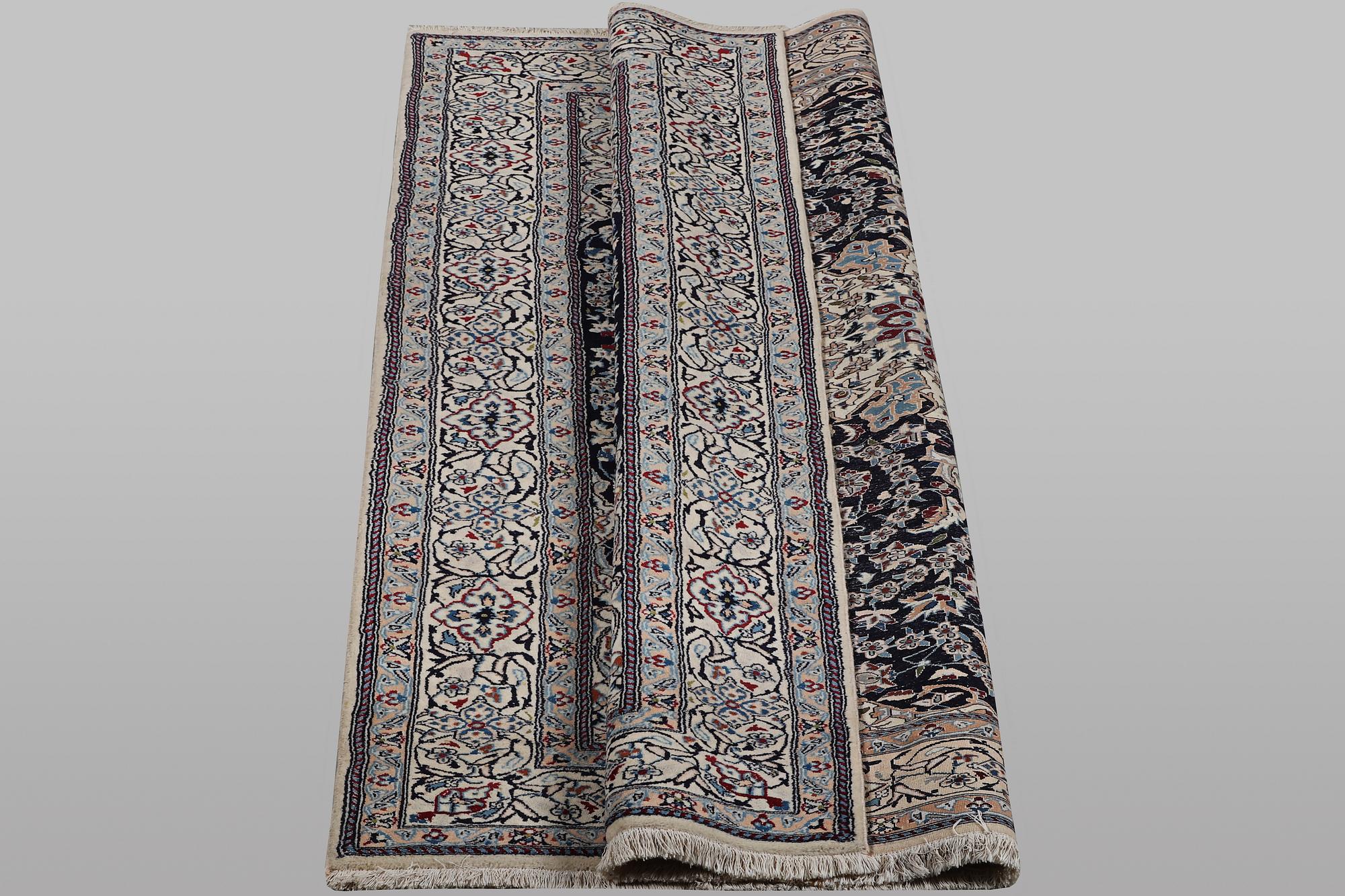 A carpet, Nain, part silk, 9 Laa, ca 295 x 197 cm.
