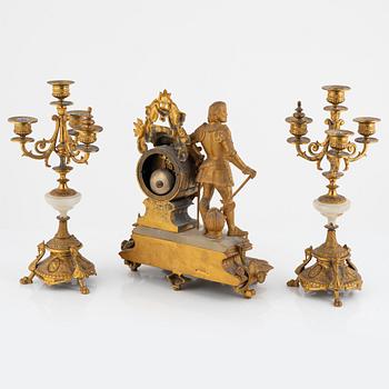 A mantel clock and a pair of candelabra, P.H. Mourey, France, late 19th Century.