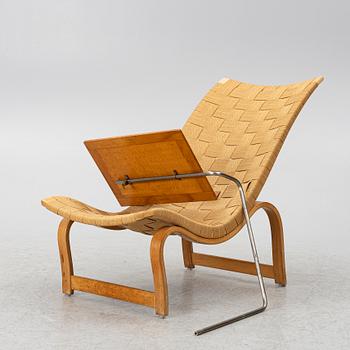Bruno Mathsson, a model 36 lounge chair, Firma Karl Marthsson, Sweden, 1940, and a reading table, Firma Karl Mathsson, mid20th century.