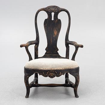 A Rococo armchair, later part of the 18th Century.