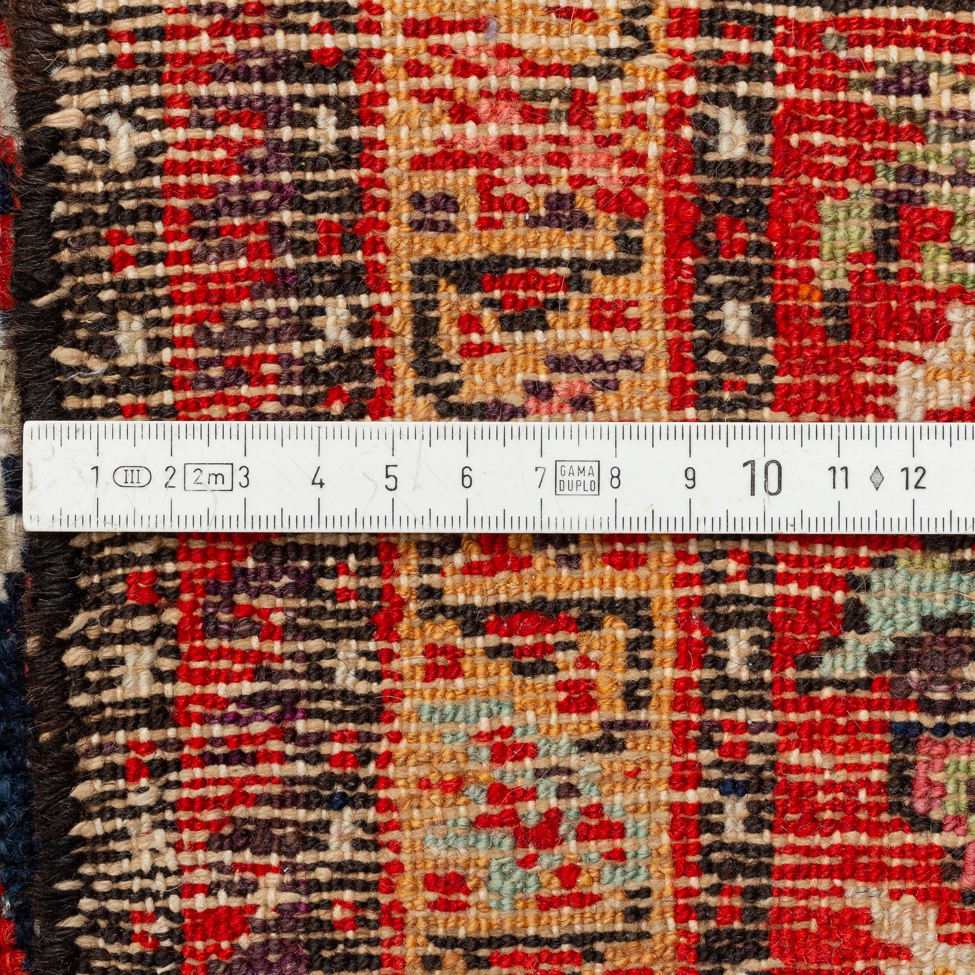 A Farahan carpet, c. 520 x 205 cm.