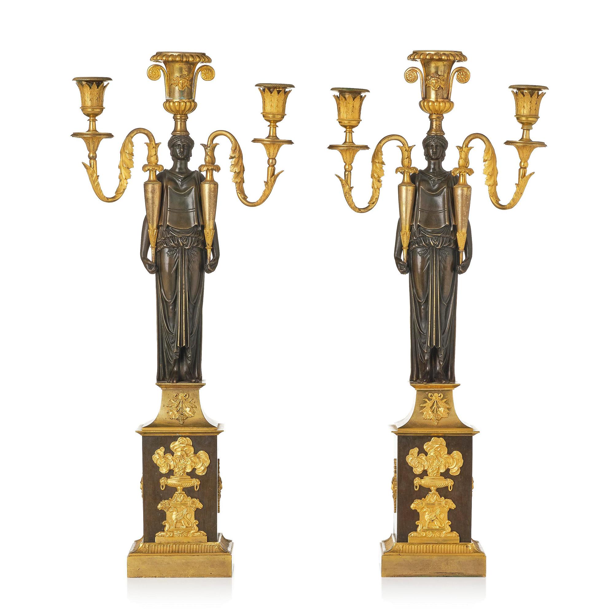A pair of French Empire ormolu three-branch candelabra, Paris, early 19th century.