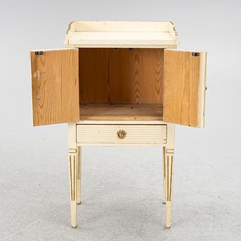 A Gustavian style bedside table, early 20th century.