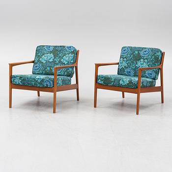 Folke Ohlsson, a pair of 'USA 75' armchairs, Dux, Sweden, 1960's.