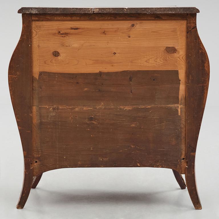 A Swedish rosewood-veneered Rococo chest of drawers, later part of the 18th century.