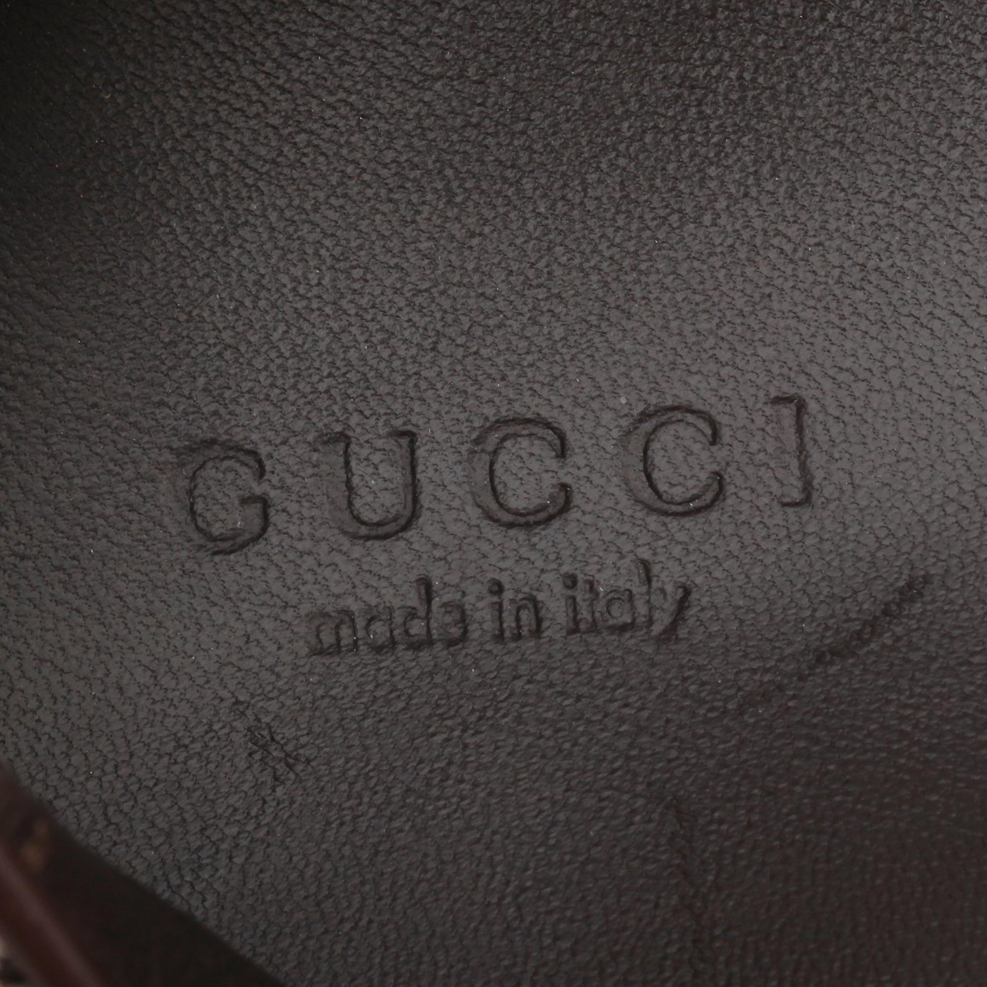 GUCCI, a pair of leopard patterned loafers.
