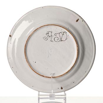 A Swedish faience charger, 18th century.