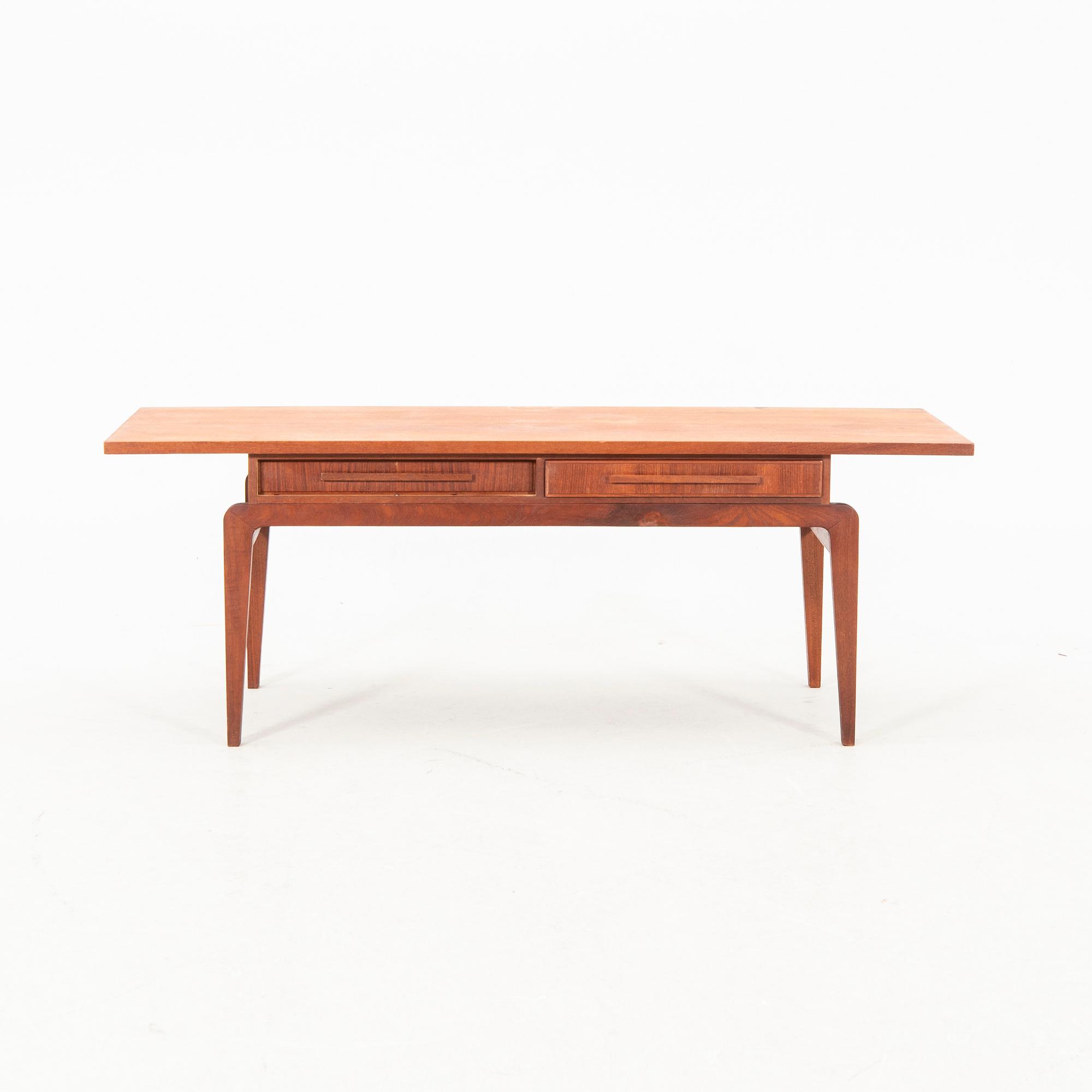 A teak coffee table from the middle of the 20th century.