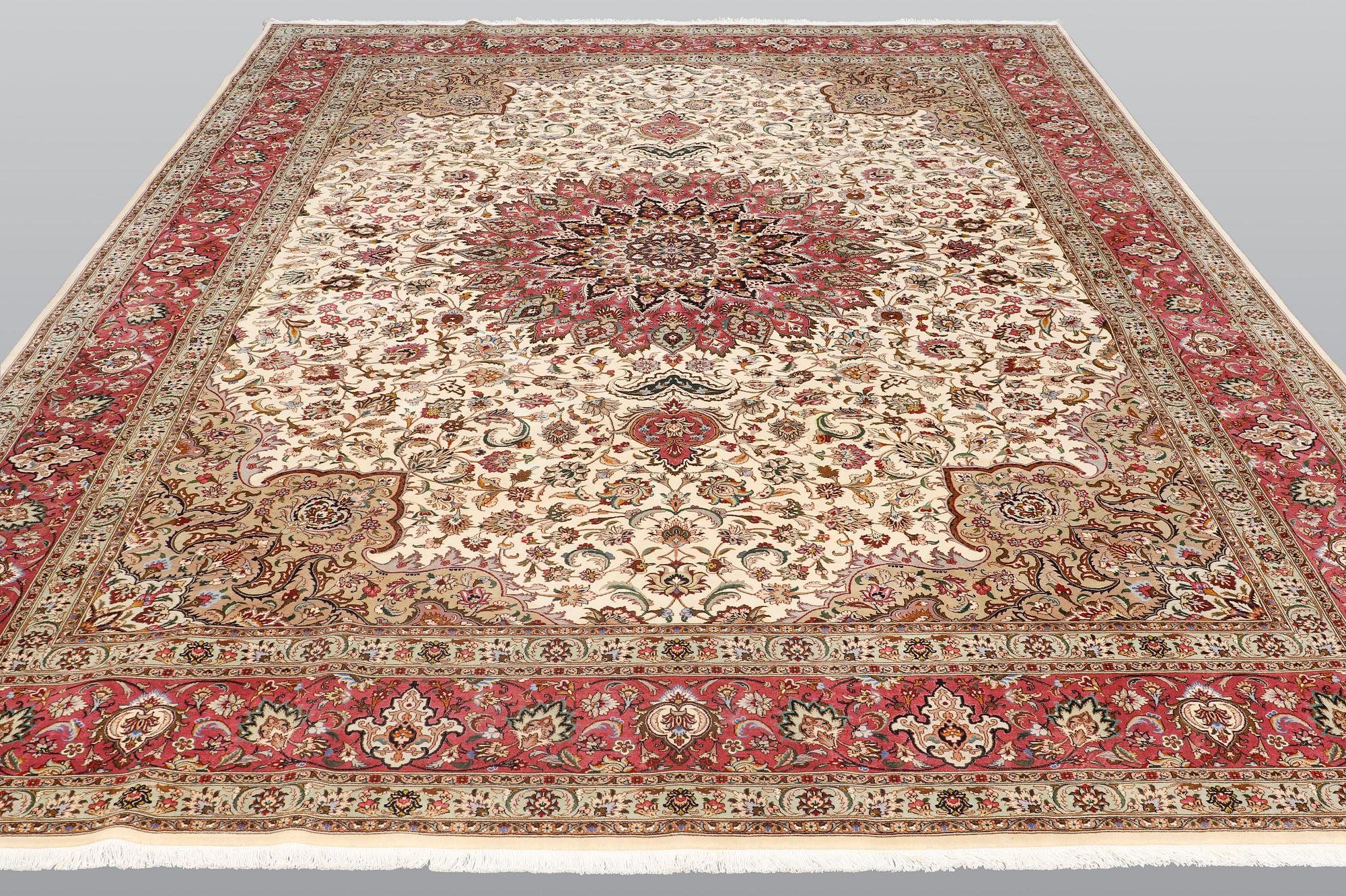 A carpet, Tabriz part silk, so called 50 Raj, cm 400 x 300 cm.